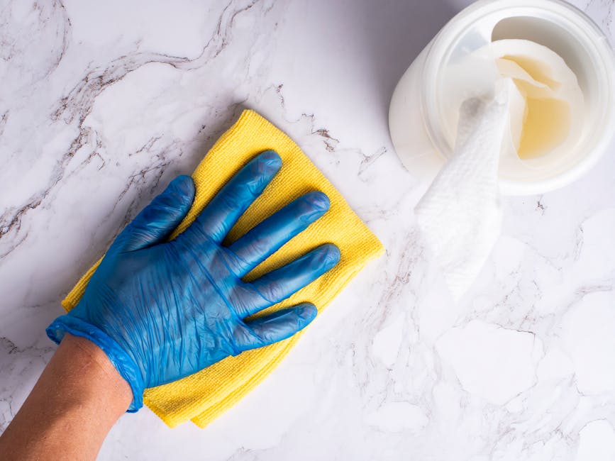 Kitchen counter being wiped clean